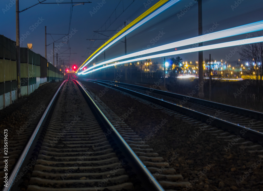 Train light trail with yellow and blue light, long exposure
