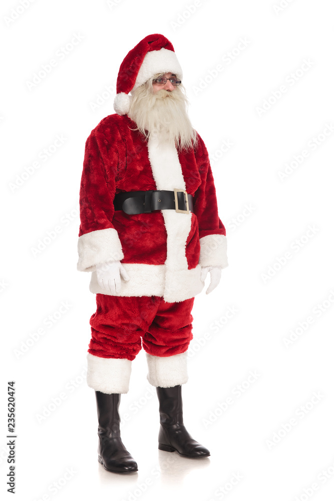 santa claus wearing glasses stands and looks to side santa claus wearing glasses stands and looks to side