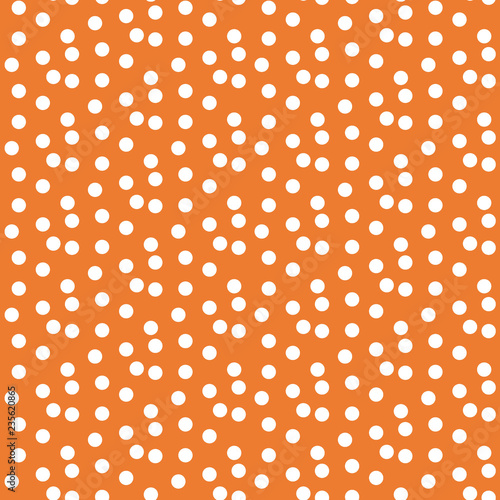 Orange background scattered dots polka seamless pattern