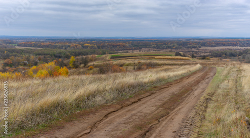 Autumnal panoramic landscape with an earth road in hilly rural area in Sumskaya oblast, Ukraine © Yuri Kravchenko