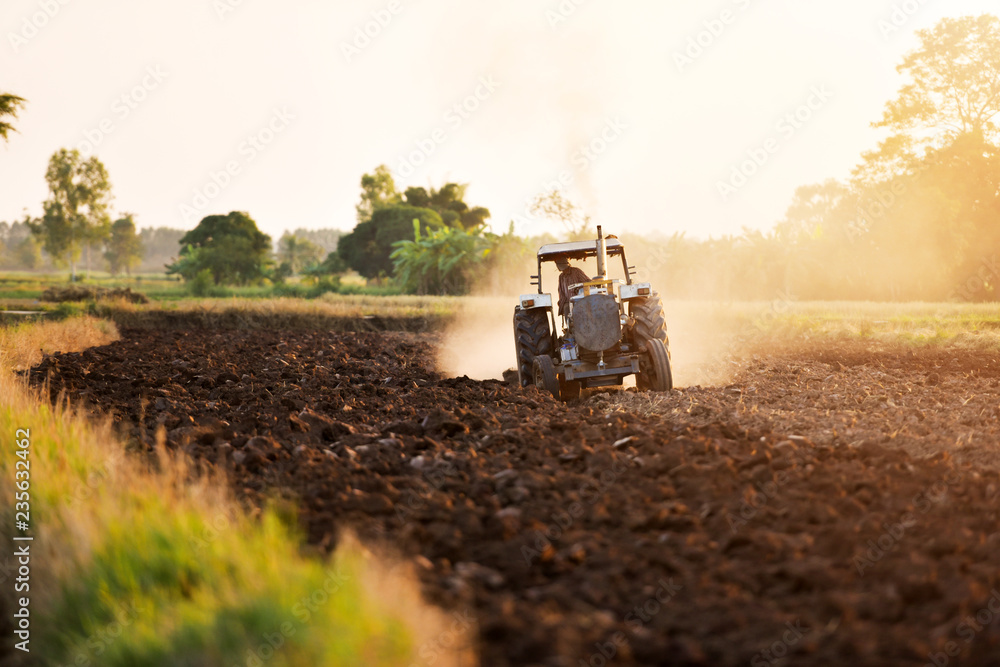 Field tractors are prepared because of growing agricultural crops in Asia. - obrazy, fototapety, plakaty 