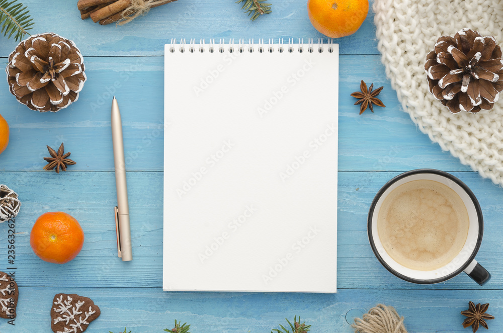 Blank notebook mock-up. Rustic blue wooden planks with anise star, pine cones and mandarine. Christmas, winter,new year,Xmas Holiday seasonal greetings card. Trendy flat lay design to do Blank notebook mock-up. Rustic blue wooden planks with anise star, pine cones and mandarine. Christmas, winter,new year,Xmas Holiday seasonal greetings card. Trendy flat lay design to do