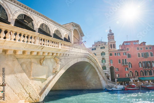 Rialto bridge with sun on Grand canal in Venice