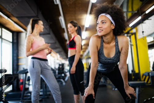 Close up image of attractive fit woman in gym