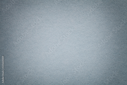 Texture of old light gray paper closeup. Structure of a dense cardboard. The silver background