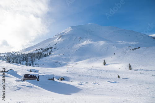 Beautiful winter landscape of The Carpathian Mountains. Petros peak covered with snow.