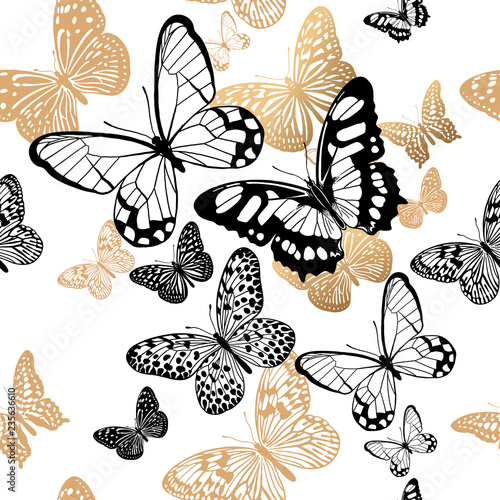 Seamless pattern with gold and black butterflies on a white background
