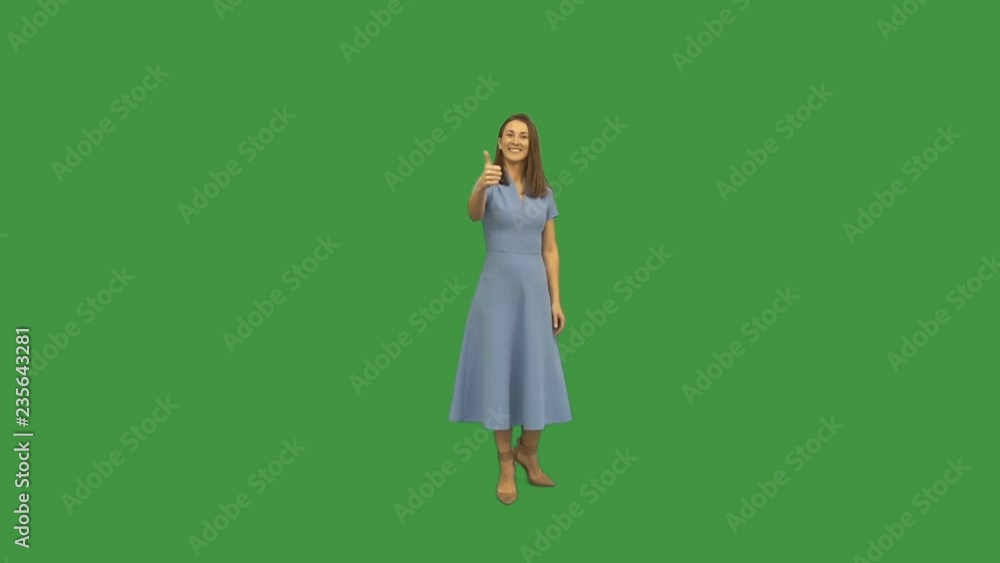 young woman smiles and shows thumb on green screen young woman smiles and shows thumb on green screen