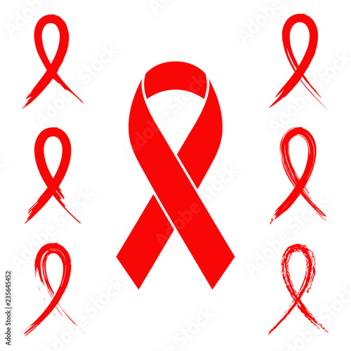 Red ribbon aids symbol in different style ink brush and hand drawn chalk designs. Set of red ribbons for aids prevention and awareness campaigns.