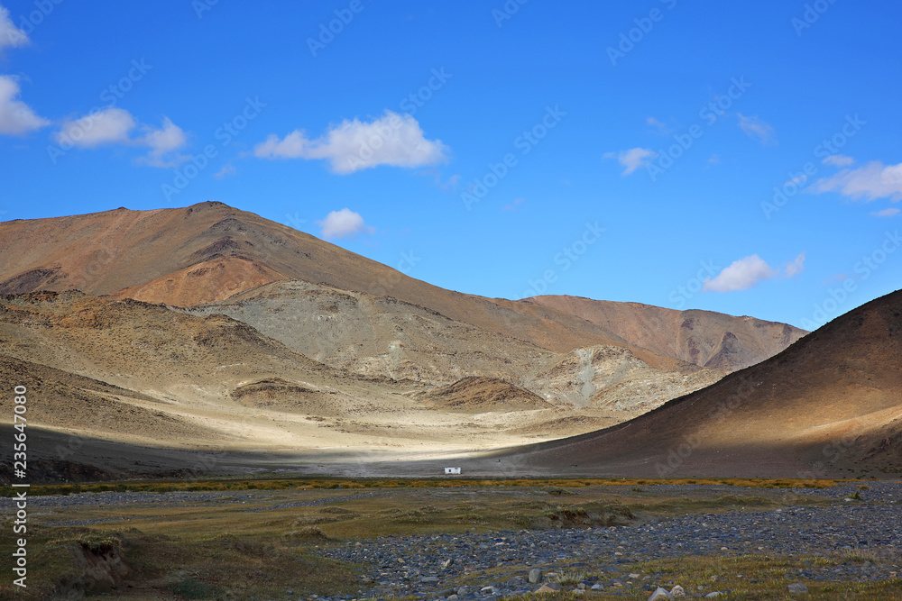 Beautiful views of the steppe and mountains with sky blue or clouds of Western Mongolia Beautiful views of the steppe and mountains with sky blue or clouds of Western Mongolia