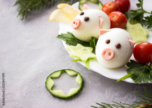 christmas cookies and decorations on wooden table pigs made from eggs and tires jn the Christmas tablefree space for text - holidays, winter, celebration,  Christmas and  new year concept  photo