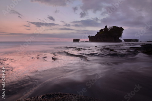 Pink sunset at Pura Tanah Lot. Bali. Indonesia