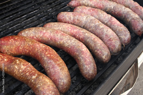 Raw stuffed sausages on a grill