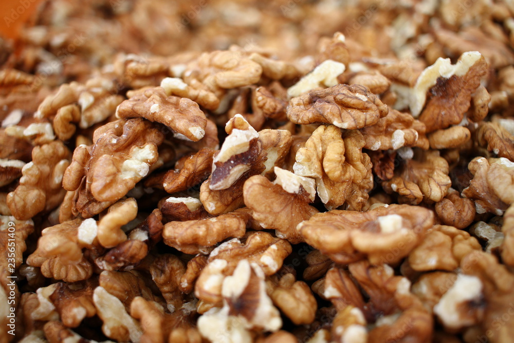 Full frame of peeled raw organic walnuts. Walnut background texture. Close up of nuts pattern. Walnuts wallpaper. Ripe and peeled walnut kernels Full frame of peeled raw organic walnuts. Walnut background texture. Close up of nuts pattern. Walnuts wallpaper. Ripe and peeled walnut kernels