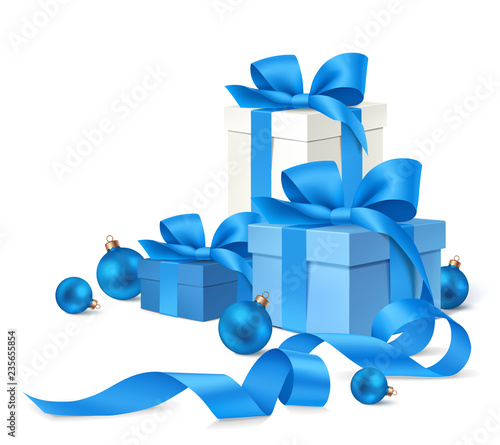 Set of decorative gift boxes with blue bow and Christmas balls isolated on white