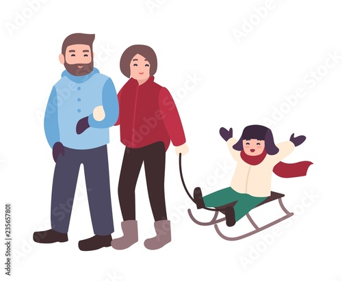 Parents drawing sled with their son
