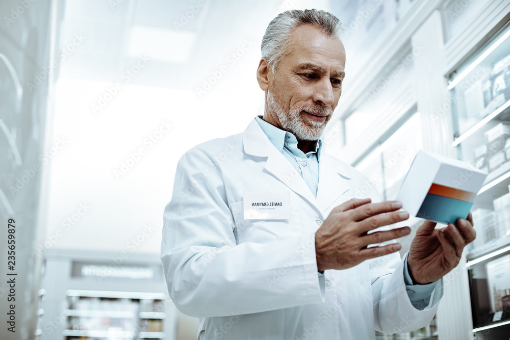 Professional pharmacist working in modern drug store Professional pharmacist working in modern drug store