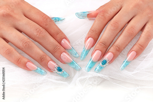 Obraz na plátně Closeup shot of long female fingers with long beautiful nails