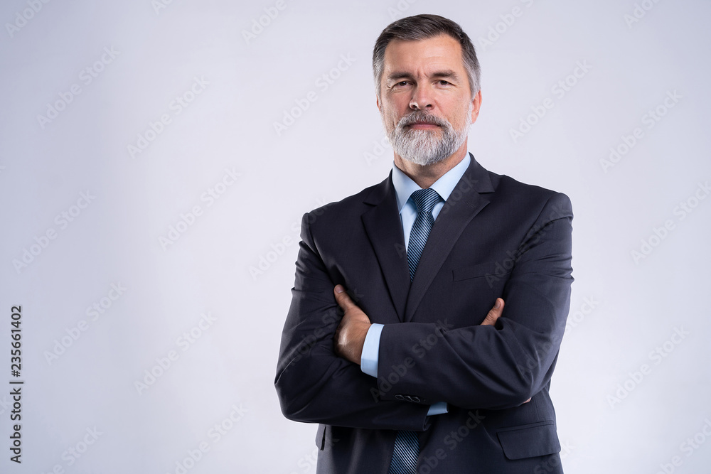 Happy satisfied mature businessman looking at camera isolated on white background. - obrazy, fototapety, plakaty 