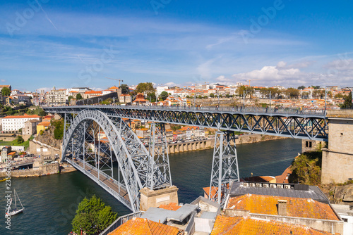 Panoramic landscape view on the old town with Douro river and famous iron bridge in Porto city in Portugal