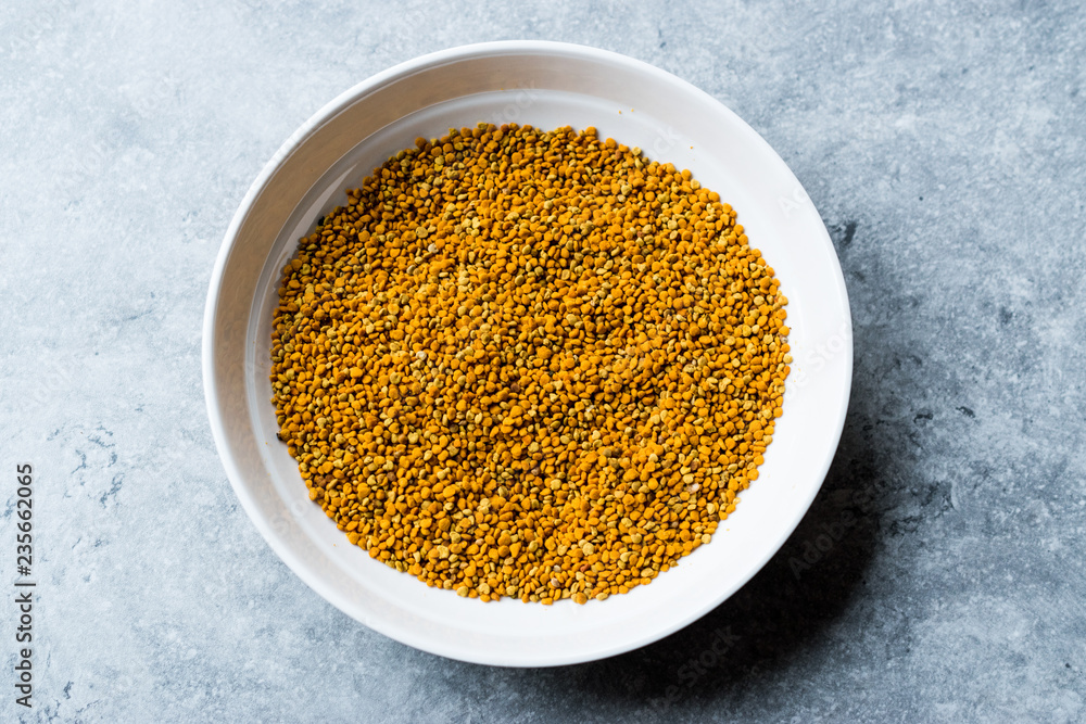 Bee Pollen Seeds in Wooden Bowl / Polen. Bee Pollen Seeds in Wooden Bowl / Polen.
