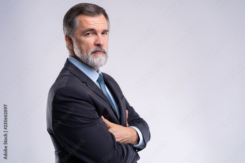 Happy satisfied mature businessman looking at camera isolated on white background. Happy satisfied mature businessman looking at camera isolated on white background.