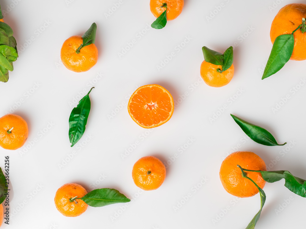 Background of fresh citrus with leaves on white. Flat lay. Top view Background of fresh citrus with leaves on white. Flat lay. Top view