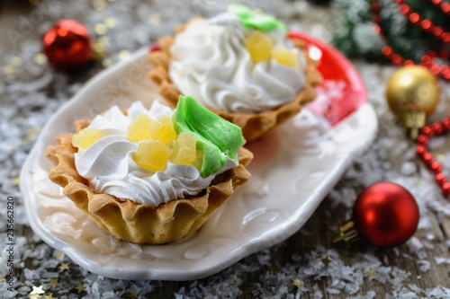 Fotografia, Obraz Delicious new year shortcake Basket  with whipped egg whites, decorated with p