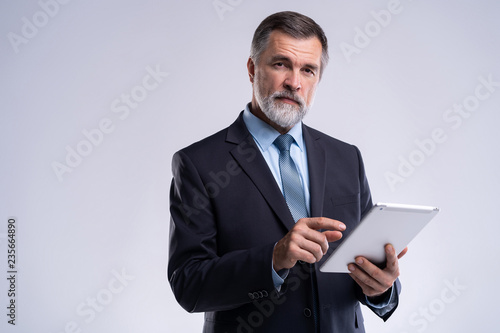 Billede på lærred Portrait of aged businessman wearing suit and tie