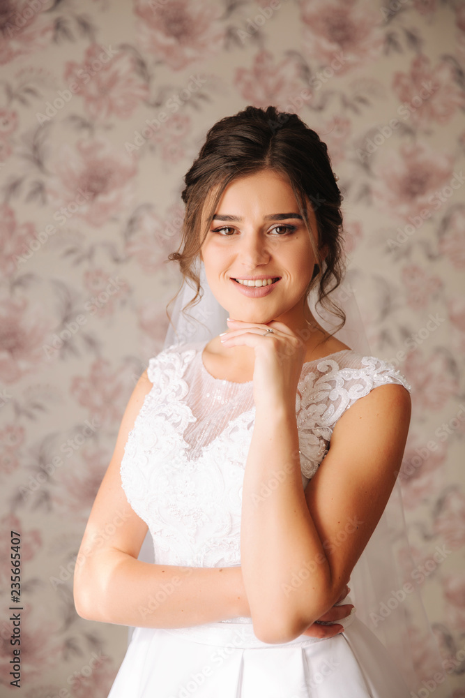 Young bride in white wedding dress. Charming and tenderness lady wait for a groom Young bride in white wedding dress. Charming and tenderness lady wait for a groom