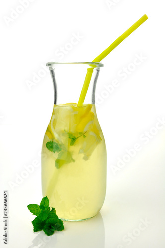 Lemonade with lemon and basil in the glass