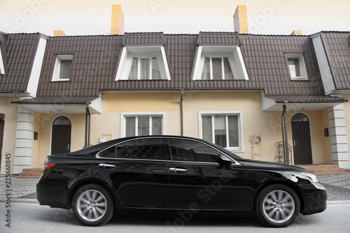 Car on the background of a private house © Stasiuk