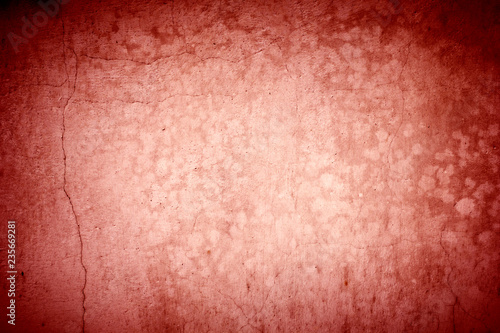 Old red dirty wall background with vignette