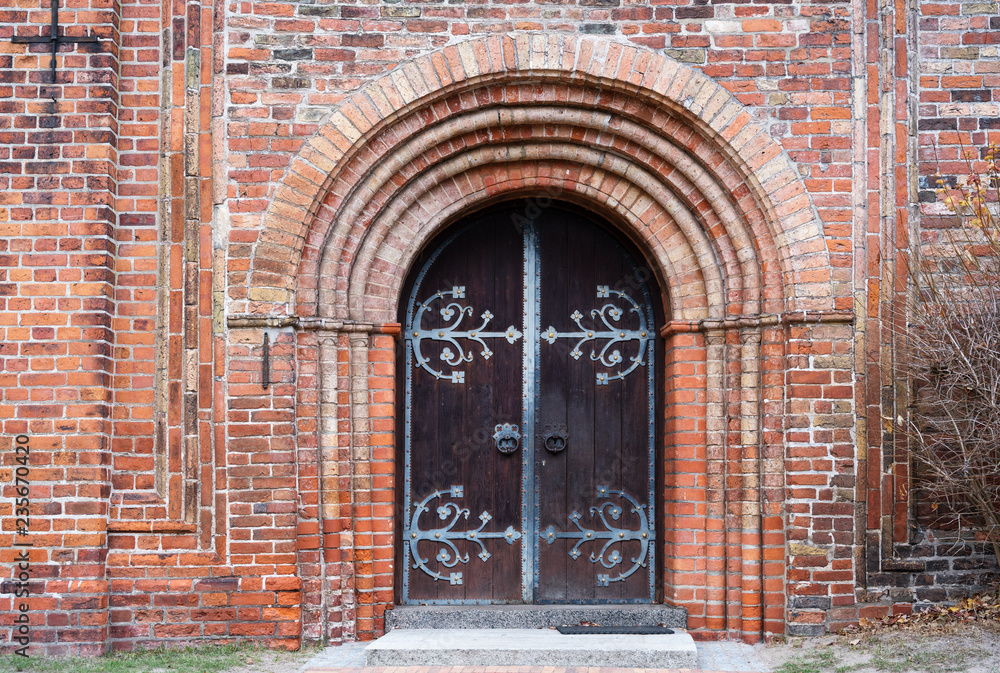 entrance door to the historic ratzeburg cathedral in typical brick architecture in north germany