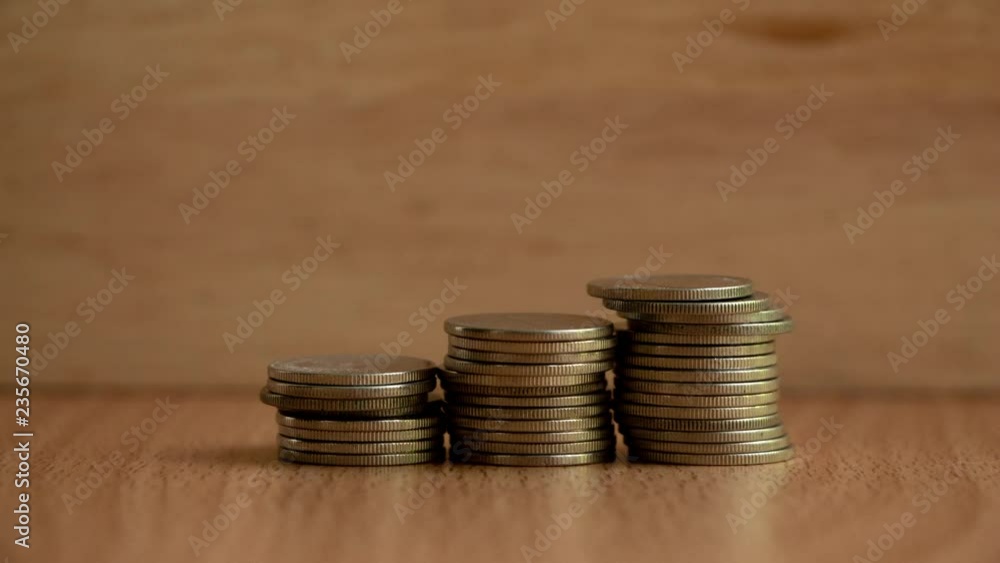 Rising columns of coins,Stacks of coins build up. 