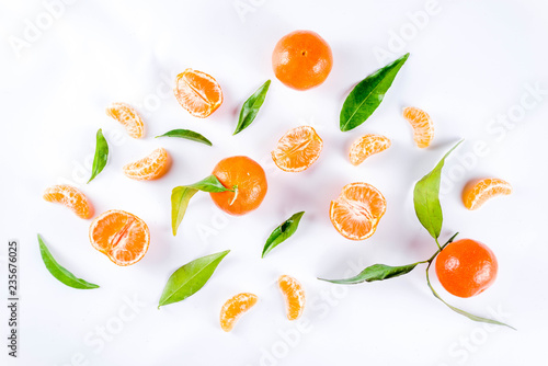 Fresh raw organic tangerines with leaves, top view flatlay copy space