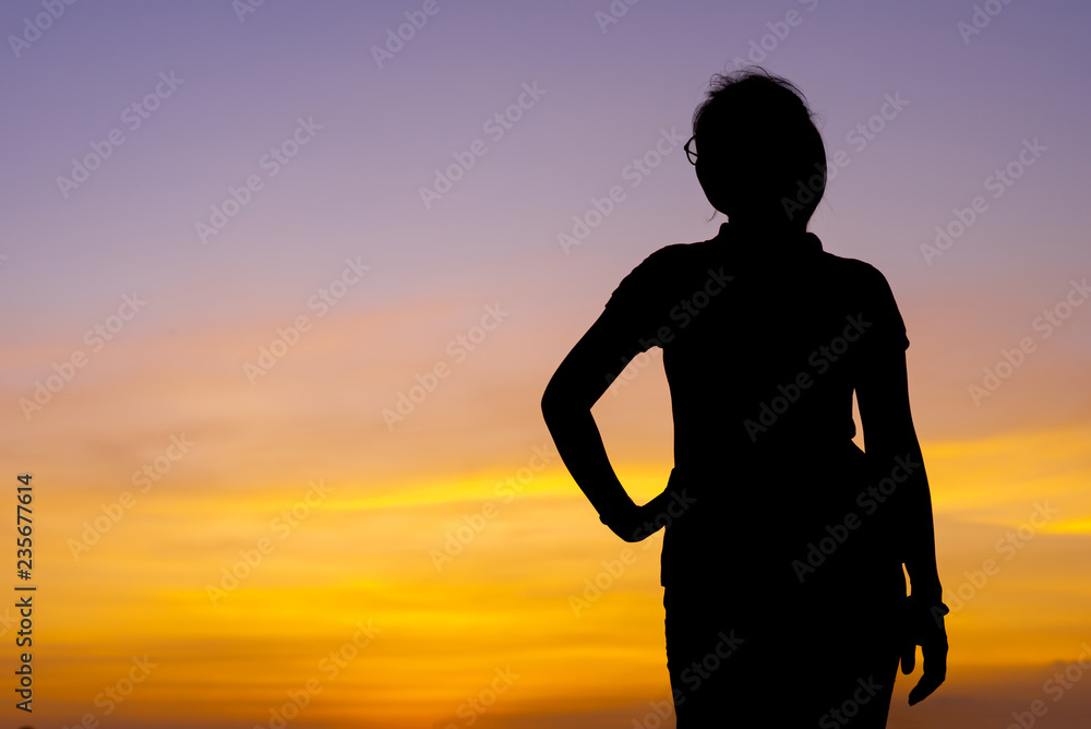 Young woman relaxing with sunset