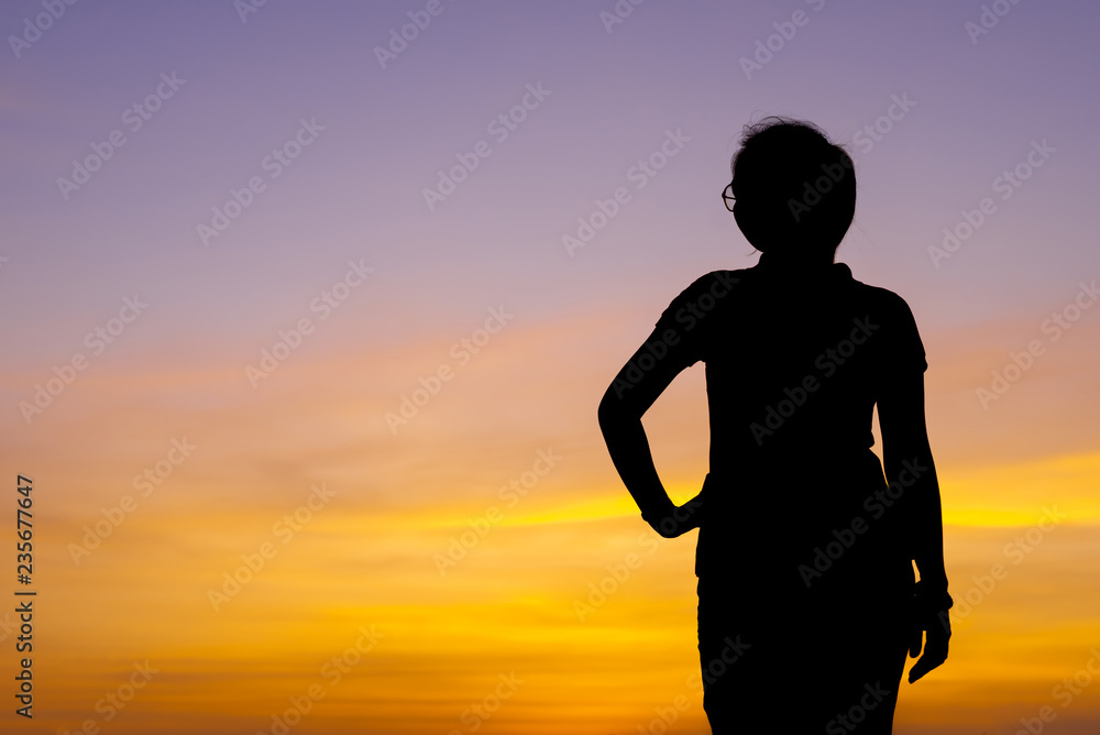 Fototapeta premium Young woman relaxing with sunset