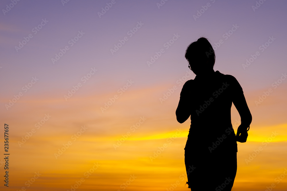 Young woman relaxing with sunset