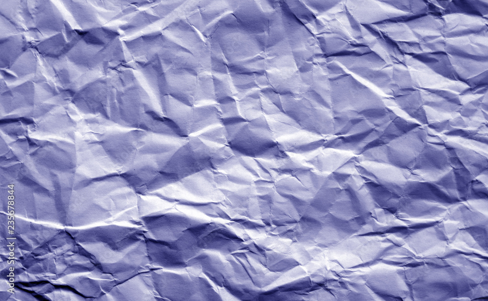 Crumpled sheet of paper in blue tone.