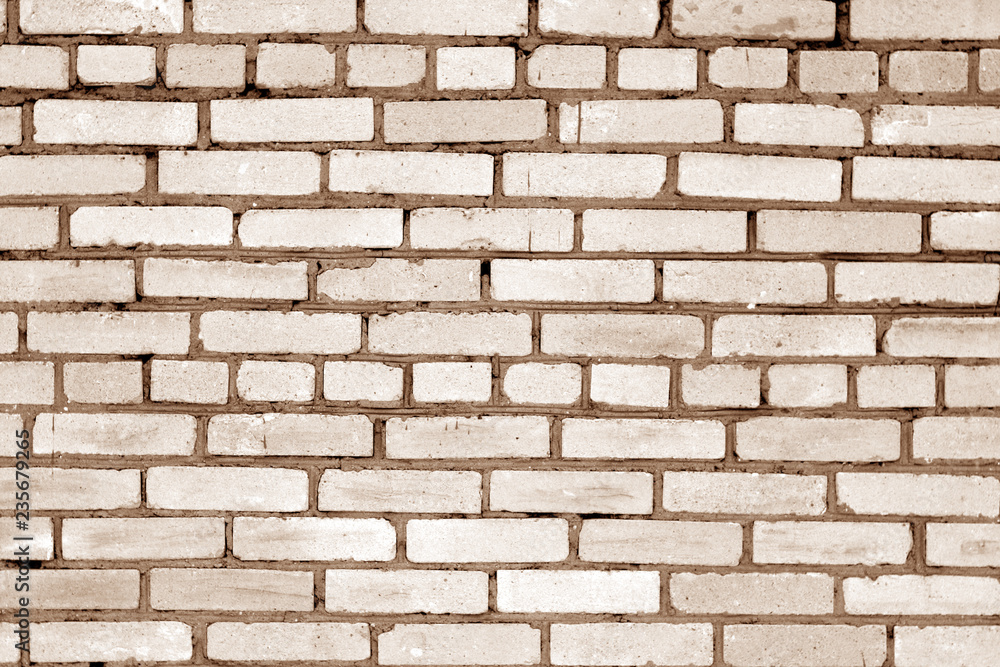 Old grungy brick wall surface in brown tone. Old grungy brick wall surface in brown tone.