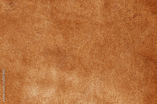 Natural leather surface in orange tone.