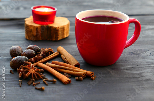 Christmas mulled wine with spices in red mug