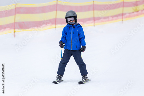 Small boy skiing on slope at mountain ski resort © skumer