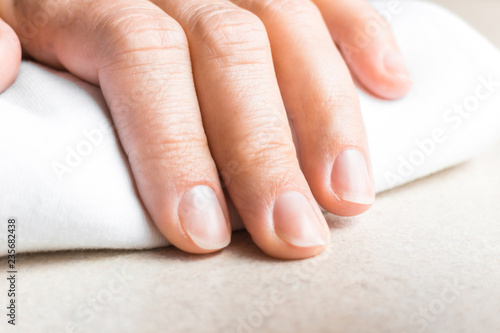 Fotografia, Obraz woman hand with unpainted fingernails