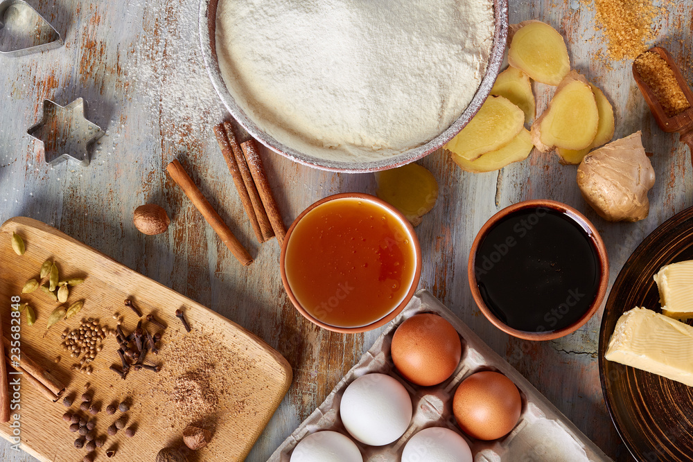 Ingredients of gingerbread recipe on wooden table