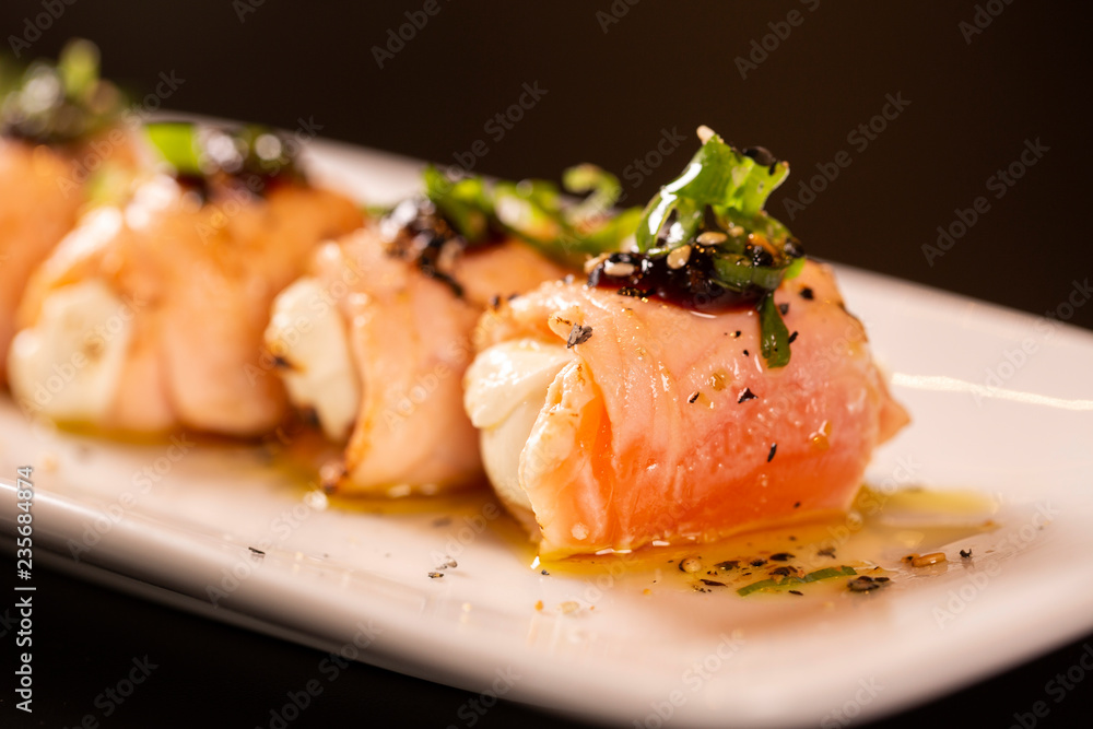 Delicious philadelphia sushi roll with grilled salmon and cream cheese.