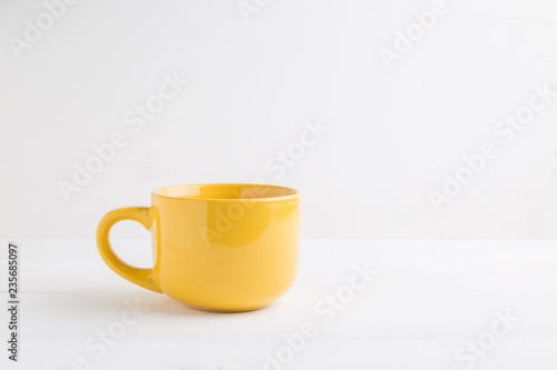 Yellow mug empty blank for coffee or tea.