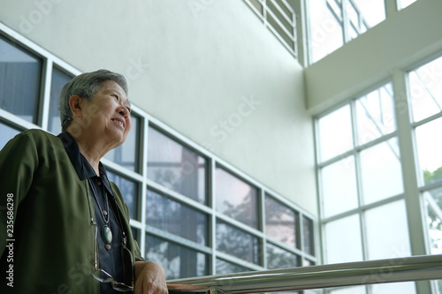 Wallpaper Mural asian elder woman resting relaxing on balcony terrace. elderly senior leisure lifestyle Torontodigital.ca