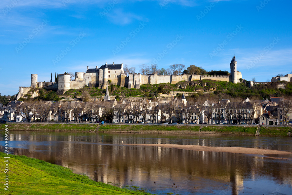 Chinon town and chateau on the hill above by the banks of the Vienne River in spring sunshine, Indre-et-Loire, France